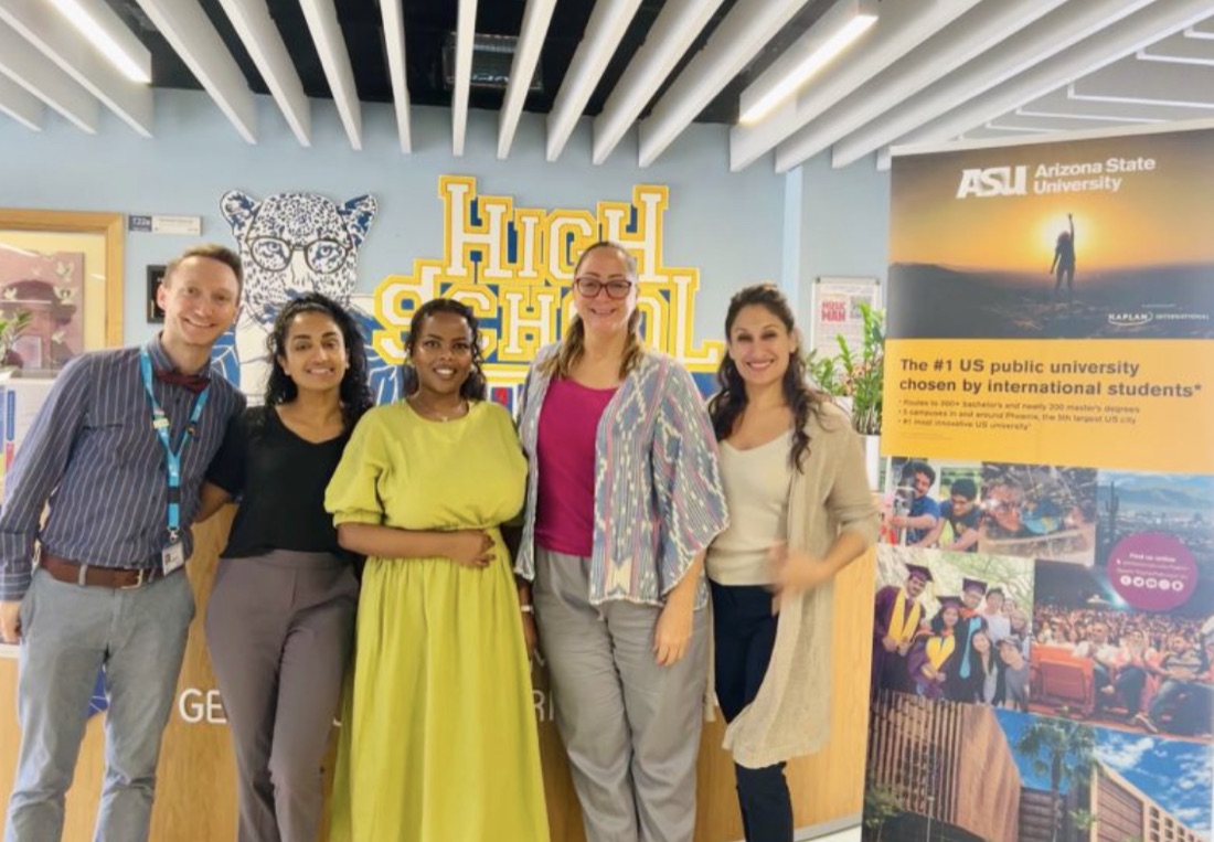 Shay (second from left) with fellow counselors at a college fair abroad